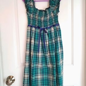 A green plaid childrens dress